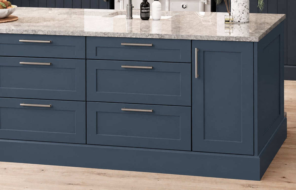 Kitchen island with dark blue Shaker doors and bar handles